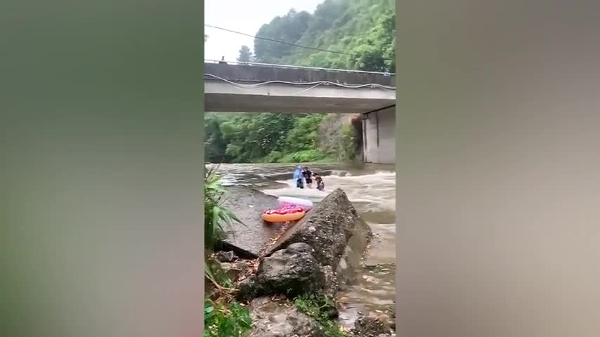 kind-hearted-residents-rescue-family-of-four-trapped-in-flooded-river-in-china---buy-sell-or-upload-video-content-with-newsflare-480p.mp4